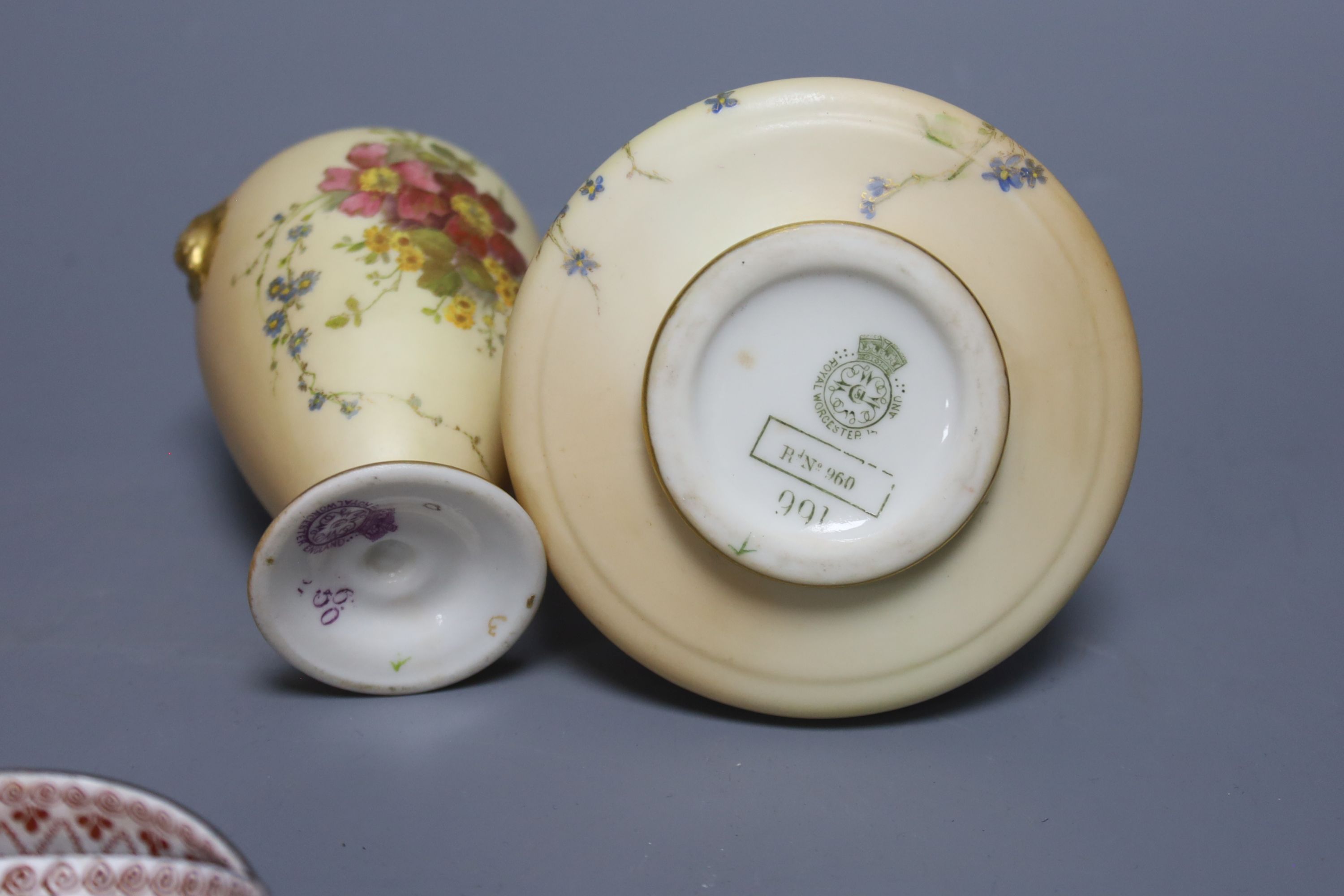 Two Royal Worcester blush pots and a set of six enamelled metal cups and saucers